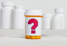 Are Antidepressants Better Than Placebo for Some? Not So Fast, Researchers Caution A pill bottle with a question mark on its label in front of other bottles.