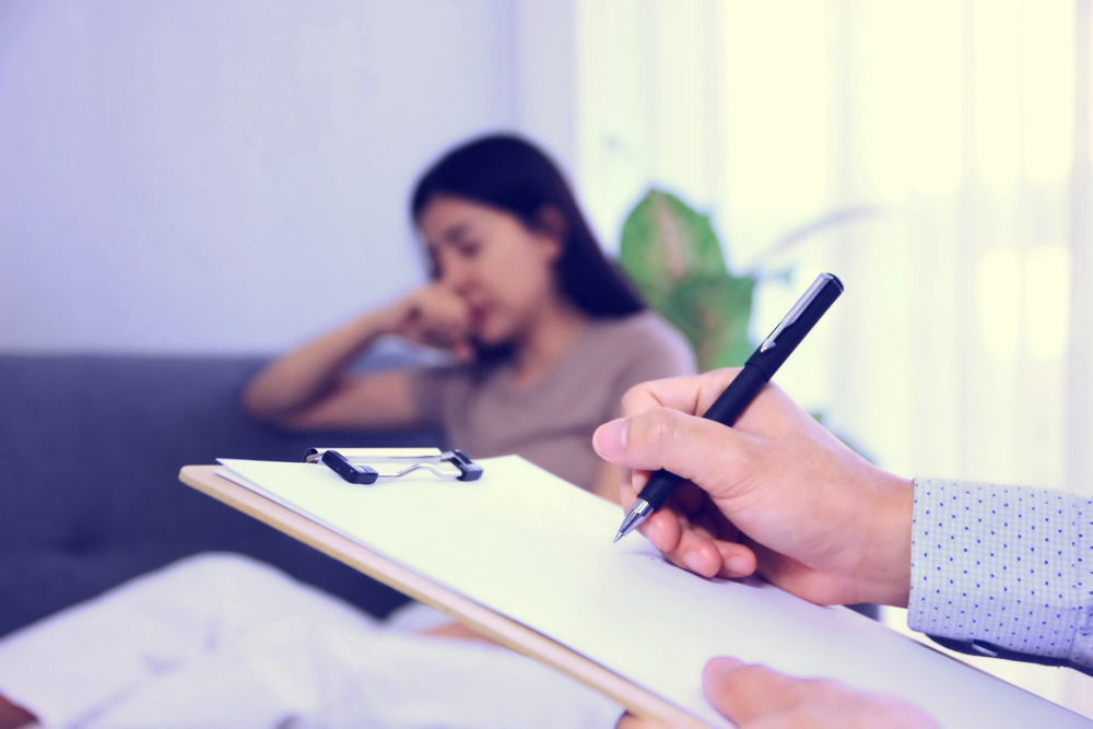 the psychologist is recording data obtained from patient interviews and prepare medical steps.