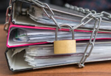 “Beware, Scientology Related”: How ADHD Experts Silence Criticism Photo of a padlock chaining a set of document binders