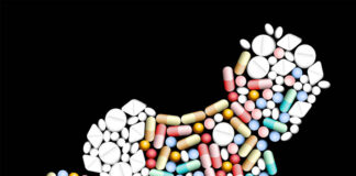 Health Risks to Babies When Antidepressants Used During Pregnancy Illustration of a shape of a baby crawling made out of various types of pills, on a black background