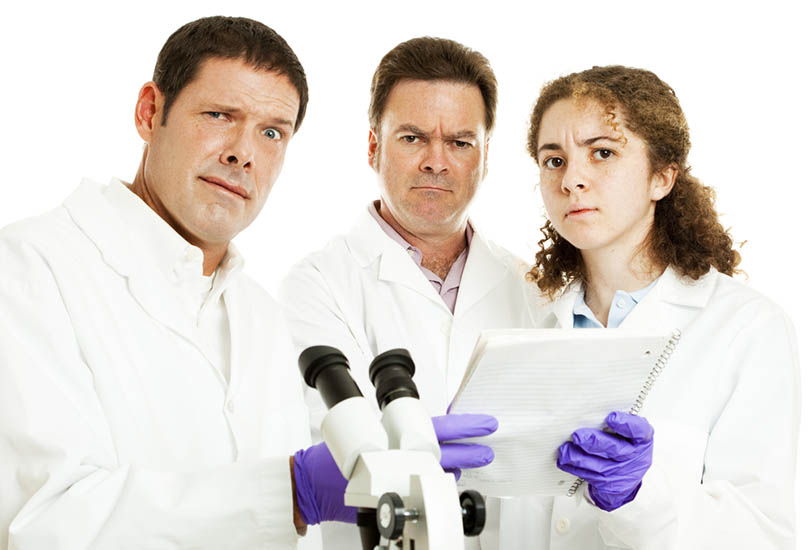 Perplexed, confused scientists looking at lab results. White background.