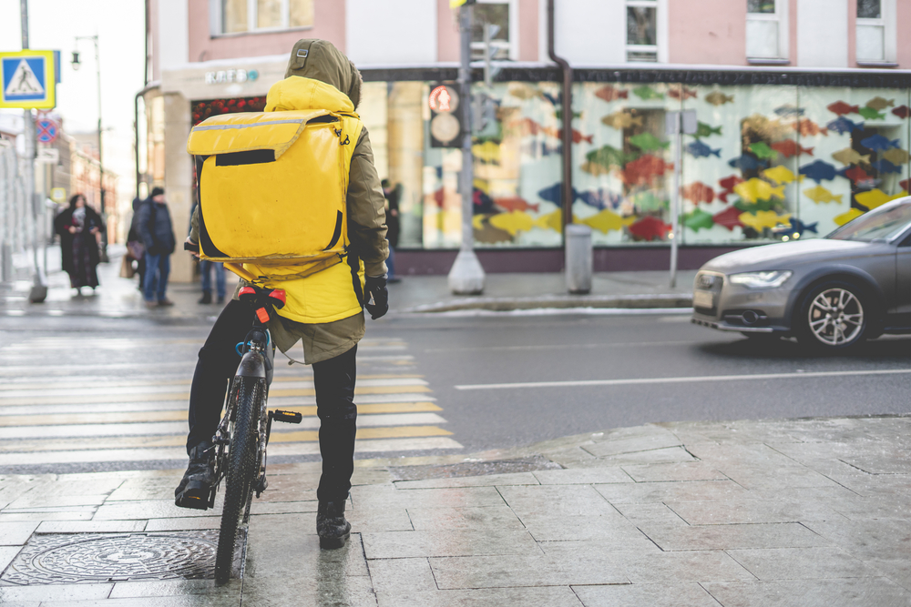 Courier on bike delivery.