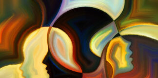 An abstract painting depicting heads in profile in various colors