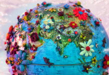 Mad Studies Needed to Decolonize Global Mental Health flowering globe