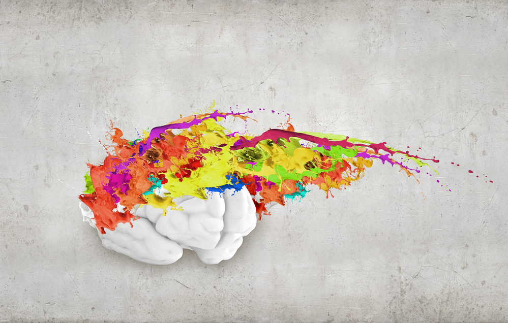 Conceptual image of human brain in colorful splashes