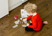 Driving Our Children into Suicide with Escitalopram and Other Happy Pills A child playing with pills