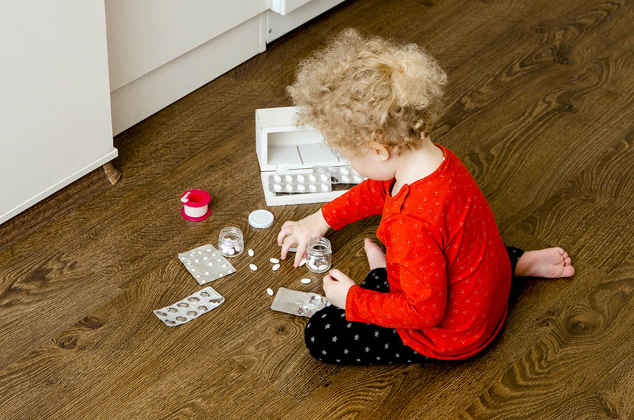 A child playing with pills