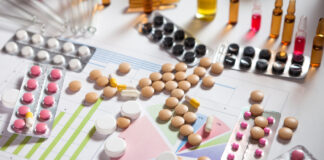 Psychiatric Journals’ Pro-Pharma Publication Bias Hides Suicide Risk of Antidepressants Pile of pills in blister packs background