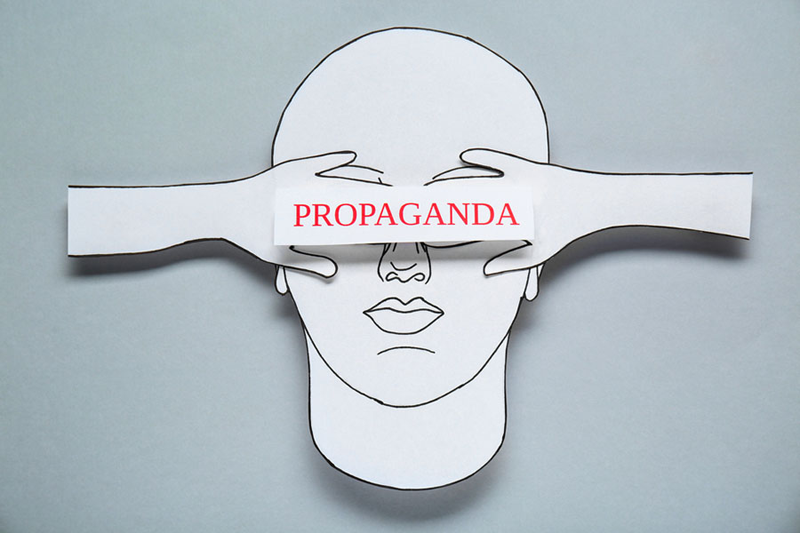 Illustration of a head with hands over eyes and the word "PROPAGANDA"