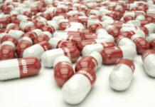 Critical Psychiatry Textbook, Chapter 9: ADHD (Part Two) 3D illustration of a bunch of red and white pills labeled "ADHD"