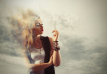 Cannabis for Pain and PTSD Goes Up in Smoke Woman smokes a cigarette in a cloud of smoke