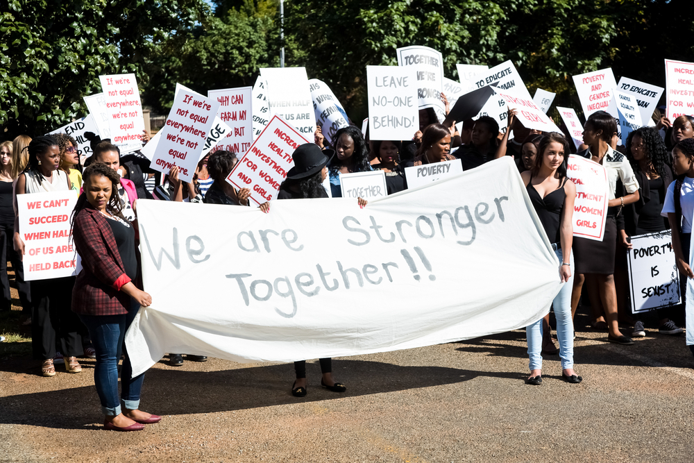 Johannesburg, South Africa - April 30, 2015: Woman's protest march in suburban street 