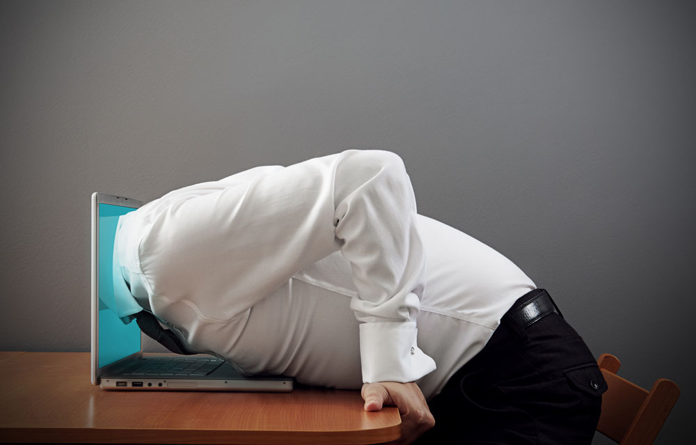 concept photo of internet addiction. man plunging into computer