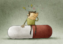 Adding Antipsychotics Worsens Outcomes in Psychotic Depression Illustration of man sitting on a red and white pill. He holds his head with pain symbols in the air above him.