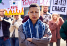 Critical Psychology Needed to Push for Radical Democracy Amid Rising Authoritarianism Group Of Protestors With Placards On Demonstration March Against Climate Chane