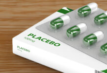 Placebo Effect—Not Antidepressants—Responsible for Depression Improvement 3D render of placebo pills isolated over wood background