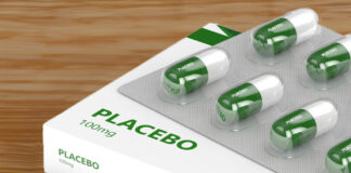 Placebo Effect—Not Antidepressants—Responsible for Depression Improvement 3D render of placebo pills isolated over wood background