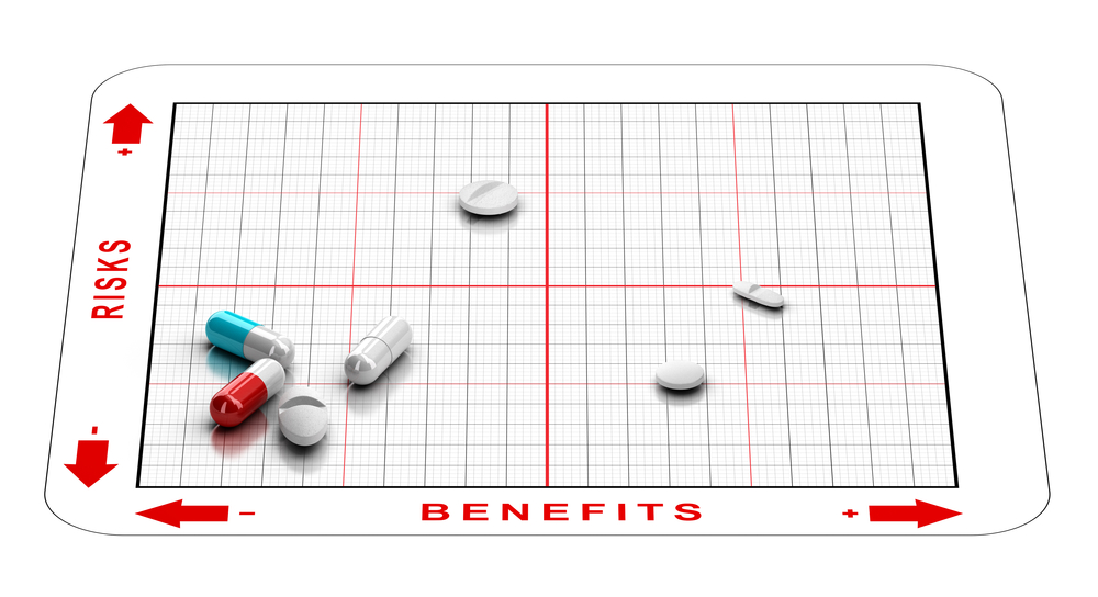 3D illustration of a matrix with tablets and the words risks and benefits. Concept of clinical trials results