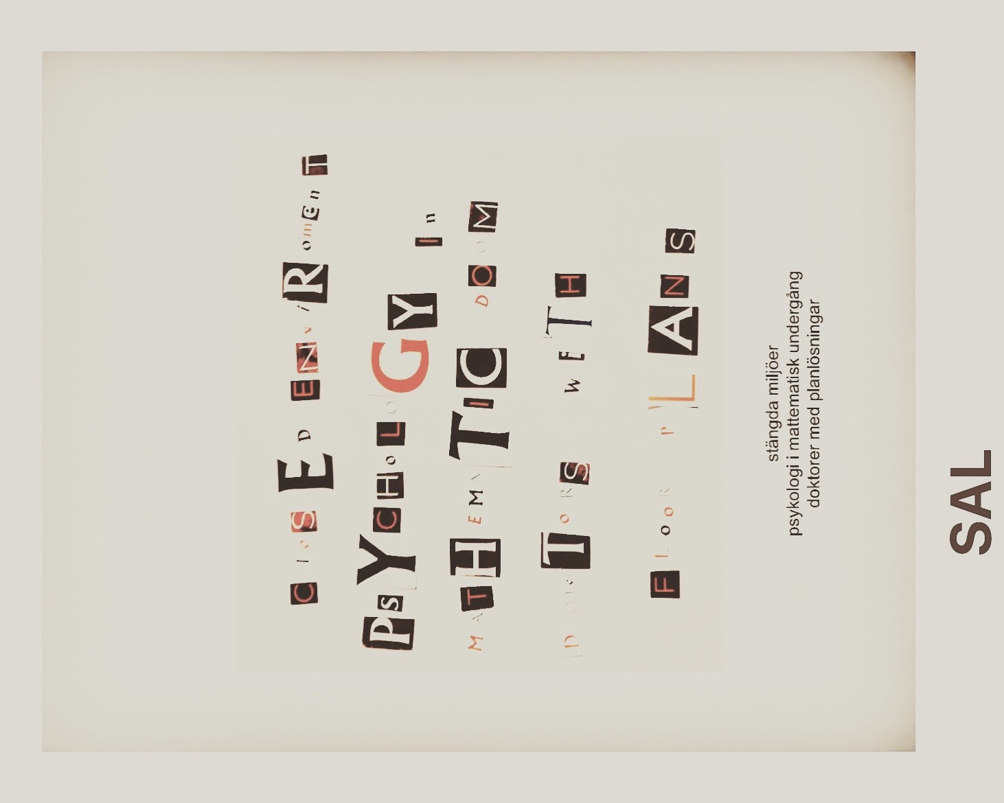 Collage with sideways cut-out red and black letters