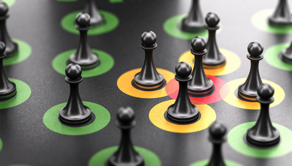 3d illustration of pawns over black background with red, orange and green circles