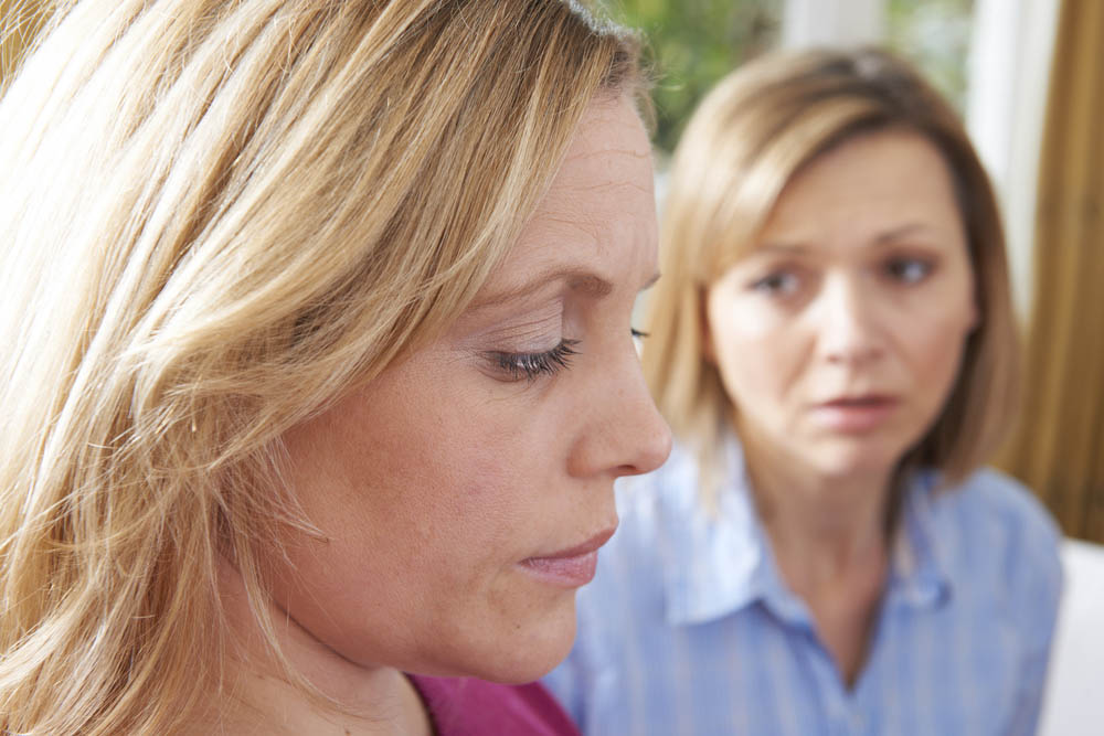 Unhappy Woman In Converstion With Friend Or Counsellor