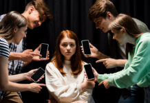 âA Dangerous Substanceâ: The Impact of Social Media on Youth Mental Health Photo of a girl surrounded by bullies holding cell phones