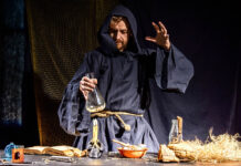 Theodoric of Arizona: State-Sanctioned Pharma-Based Pseudo-Doctor Photo of a man dressed in a plain robe doing alchemy with a glass jar over a candle
