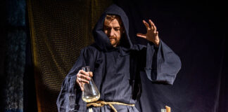 Theodoric of Arizona: State-Sanctioned Pharma-Based Pseudo-Doctor Photo of a man dressed in a plain robe doing alchemy with a glass jar over a candle