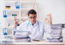 STAR*D: The Harms of Orchestrated Psychiatric Fraud Doctor looking frustrated raising hands behind a desk with piles of paper