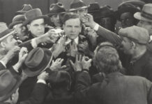 Right-Wing or Left-Wing: Who Really Owns the Critique of Over-Medicalisation? Black and white photo of a confused mob of people with one serene face in the middle