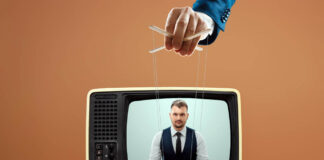 Gigantic Hoax on Danish National TV: “Patients with an ADHD Diagnosis Die Five Years Earlier if They Are Not Treated with Drugs” The puppeteer's male hand manipulates the news announcer in the TV