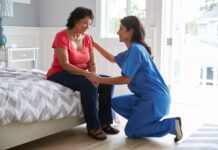 How I Developed a Critical Perspective on Psychiatry A female nurse helping another woman
