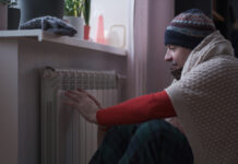 Senior caucasian man feeling cold at home with home heating trouble