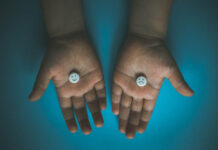 Observational Studies Confirm Trial Results That Antidepressants Double Suicides Two hands holding pills, one with a smiley face, the other with x's for eyes and a frown