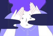 Flat illustration of an anxios person holding their head with their hands.