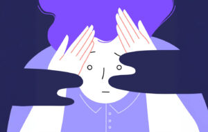 Flat illustration of an anxios person holding their head with their hands.