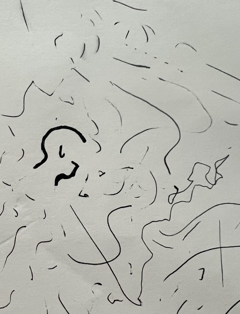 A series of squiggles and disconnected lines in black ink on a gray background