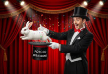 A magician pulling a rabbit out of a hat labeled "Forced Treatment"