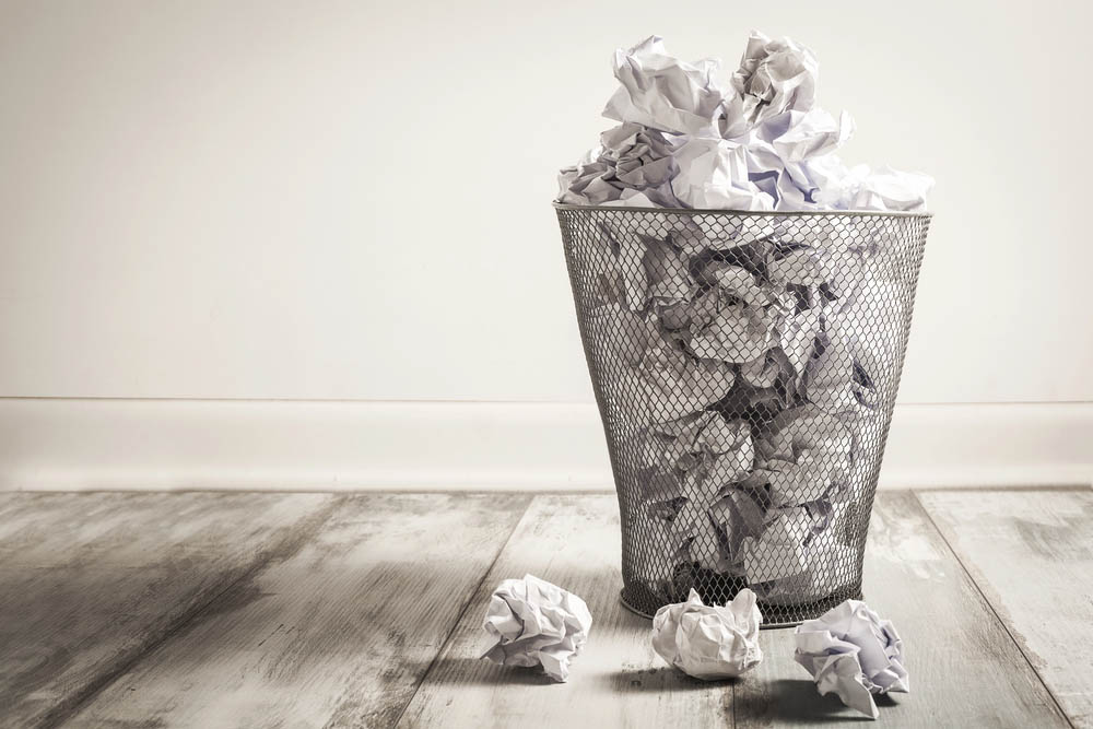 Crumpled papers in a trashcan