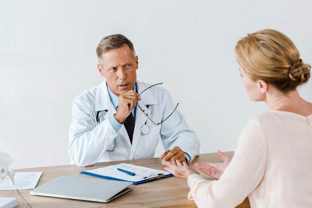 Doctor explaining something to patient