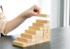 Stacking wooden blocks upward like stairs