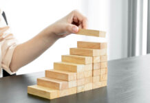 Stacking wooden blocks upward like stairs