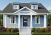 Simple single family house with words "Peer Respite " over the front door, with a sign hanging from the doorknob saying "Closed."