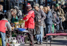 Calgary, Alberta, Canada - November 6, 2021: A small group of people providing a meal to the homeless and any other people in need in downtown Calgary