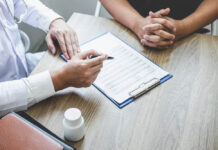 New Canadian Guidelines Strongly Recommend Against Depression Screening Doctor having conversation with patient while discussing explaining symptoms or counsel diagnosis health and consult treatment of disease, healthcare and assistance concept.