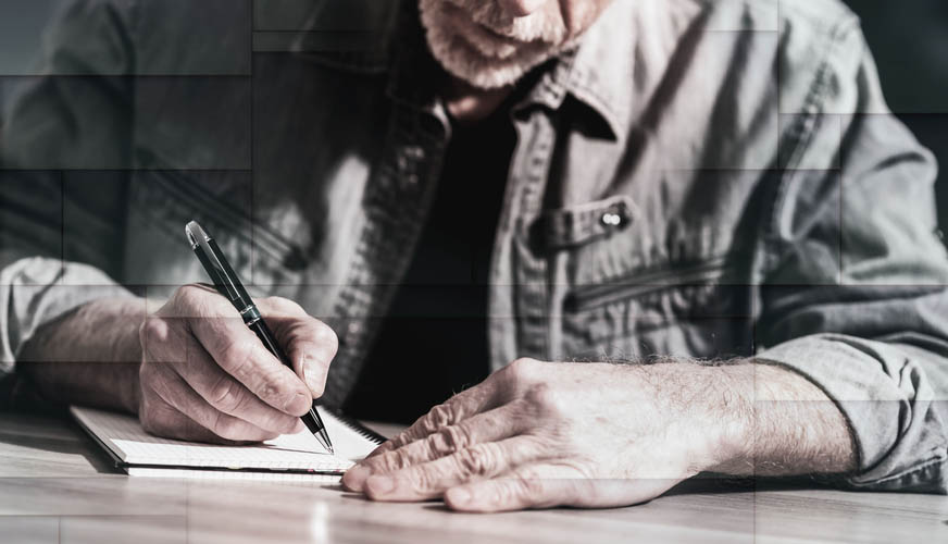 Older man writes a letter