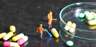 Antidepressant “Maintenance Treatment” Not Required: Slow Tapering with Support Works Miniature people - The worker at work with medicine pills