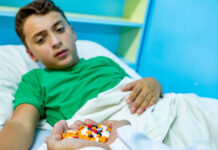 We Must Stop the ADHD Prescribing Cascade, Not Perpetuate It Child being given a huge handful of various pills