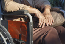 Psych Drugs Linked to Increased Risk of ALS older adult hands close-up, wheelchair