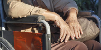 Psych Drugs Linked to Increased Risk of ALS older adult hands close-up, wheelchair